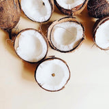Coconuts are split in half with the fruit on the inside and husk on the outside.
